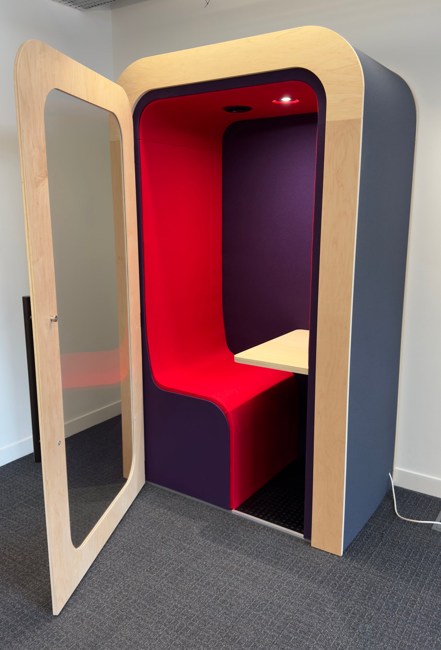 Compact single workspace pod featuring acoustic foam for superior soundproofing.